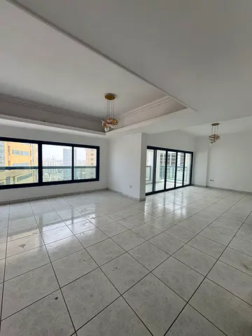 Elegant and beautiful two-bedroom apartment with two living rooms and a maid's room available for annual rent in Al Majaz 2, first row on the lake, wi