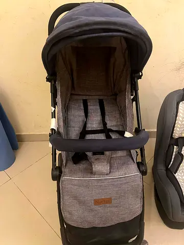 Lightweight gray Nurtur baby stroller - good condition