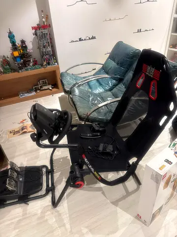 Racing Simulator Setup with Wheel and Pedals