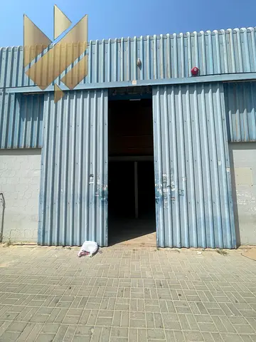 Warehouse with mezzanine and 3 offices available for rent in Industrial Area18,Sharjah,featuring a wide entrance,prime location,and acompetitive price