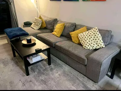 Large Grey L-shaped Sofa with Cushions - Good Condition