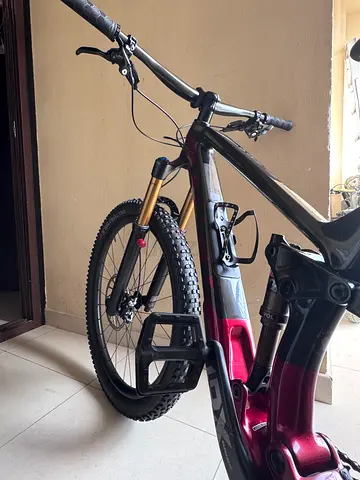 a 2021 Trek Fuel EX 9.9 X01 AXS, a top-tier carbon trail mountain bike. It is designed to be a beast