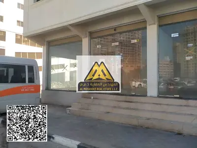 محلان كبيران للإيجار في النعيمية بموقع حيوي ومميز مناسب لمختلف الأنشطة التجارية مع إمكانية دمج المحلين وفتح مشروع تجاري واحد بمساحة أكبر أو استخدام كل