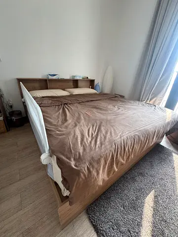 Double wooden bed with headboard storage - good condition, 600 AED for all.. without mattress..