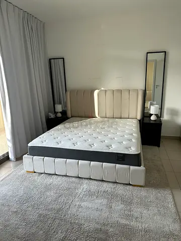 Double upholstered bed frame with mattress and 2 bedside tables