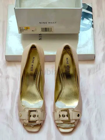 Women high heels leather shoes from Nine West new size 8,5 for 100 AED.