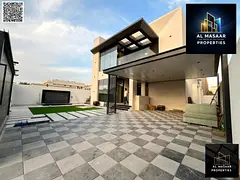 Luxury villa with a modern design, 5000 sq ft, with a garden, behind Ajman Academy. Price includes a