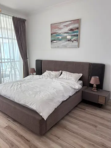 Modern upholstered king-size platform bed with headboard and nightstands. Comes with matress.