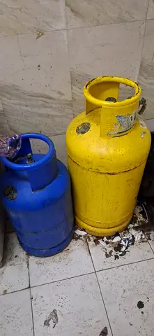 Two Used LPG Gas Cylinders (Blue  Yellow) - Good for Home Use