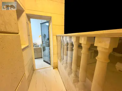 A furnished apartment with two bedrooms and a living room, brand new furniture (first tenant), located on Al Ittihad Street in Al Nuaimiya 1, close to