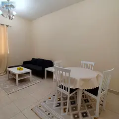 * Furnished one-bedroom apartment with a living room * Location: Al Amira Village, Al Yasmeen area *