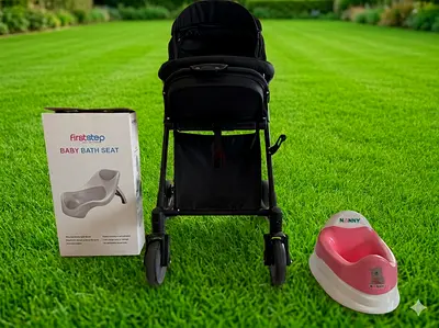 Lightweight black stroller with baby bath seat and potty!