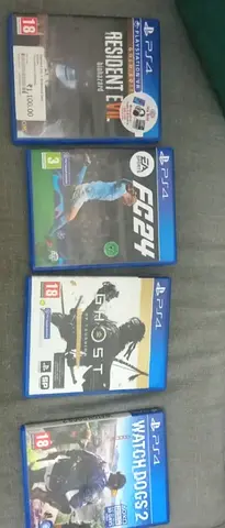 Collection of 4 PS4 Games — Resident Evil 7, FIFA 24, Ghost of Tsushima, Watch Dogs 2 with controler