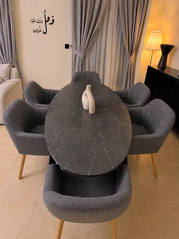 Oval Gray-Top Dining Table with 6 Upholstered Chairs