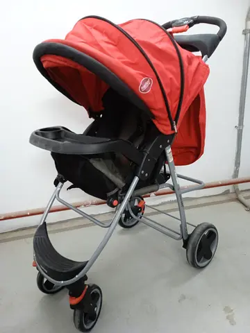 Used red baby stroller/pram in good condition