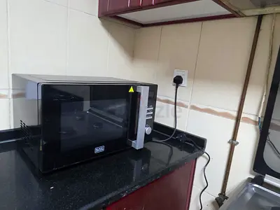 Harly used Black Countertop Microwave Oven - Good Working Condition 10/10