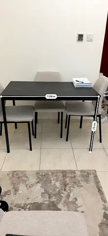 Simple black dining table with 4 upholstered chairs - good condition