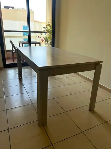 Solid wood dining table - simple rectangular design, good condition