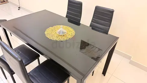 Black Glass Top Dining Table with 4 Modern Black Chairs - Good Condition