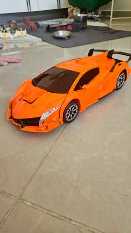 Remote control orange sports car toy (used, works)