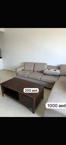 Beige L-shaped Sofa with Wooden Coffee Table - Good Condition