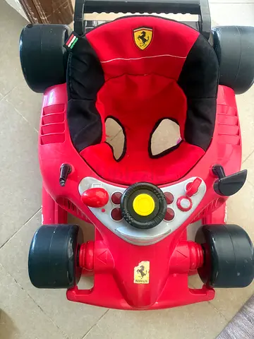 Red Ferrari-style Ride-on Car for Toddlers — Good Condition