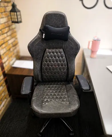 Used ergonomic gaming/office chair with lumbar pillow