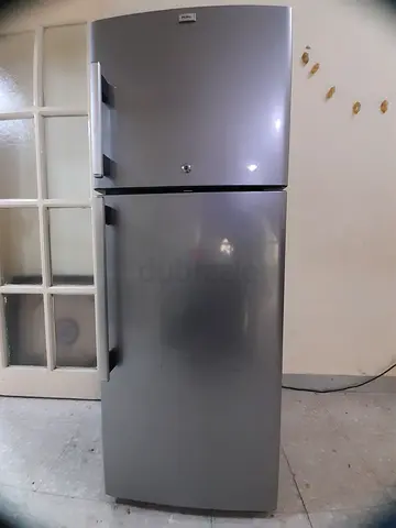 Silver top Haier 248litres  -freezer refrigerator in good working condition