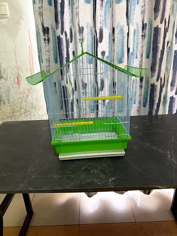 Small green bird cage with perches and removable tray - good condition