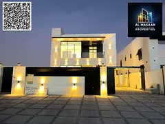 Luxury villa with a modern design, 5000 sq ft, with a garden, behind Ajman Academy. Price includes a