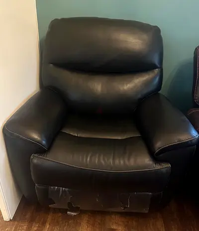 Dark brown leather recliner armchair - recently bought still has plastic on