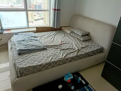 Beige upholstered double bed with mattress - good condition