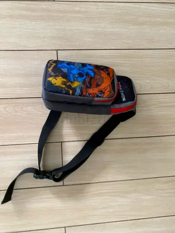 Pokemon crossbody sling bag — grey with Pikachu  Charizard print