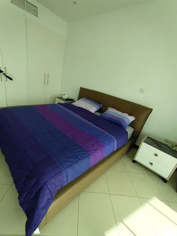 Queen leather bed frame with mattress and bedside tables - good condition