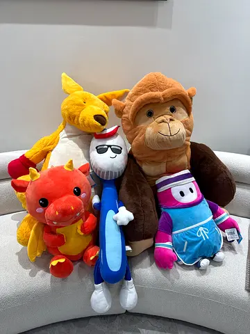 Set of 5 assorted plush toys — XL monkey, charizard, XL kangaroo, toothbrush and Fall Guys plush