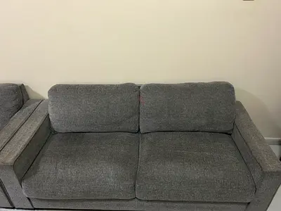 Comfortable 2-Seater Grey Fabric Sofa - Good Condition