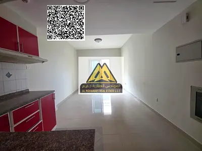 A spacious studio for annual rent in Al Hamidiya – Ajman, featuring a balcony with an open view, free parking, and central AC in a prime location clos