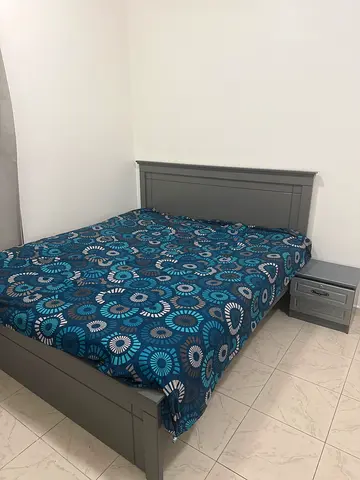 Grey wooden double bed frame with nightstand - good condition