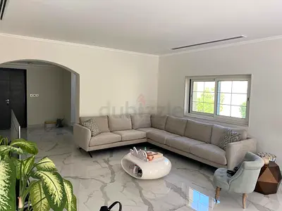 Light beige L-shaped sectional sofa in excellent condition