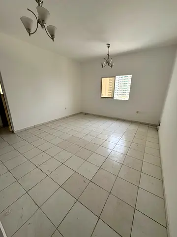 One bedroom and living room for annual rent in Al Khan area, Sharjah | Built-in wardrobes | Bathroom | Balcony inside kitchen | Central air condition