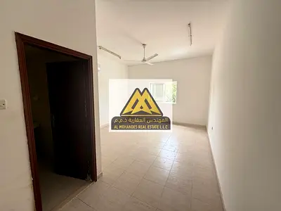 Spacious studio Al Mowaihat 3 Ajman. Semi kitchen, split AC. Direct Dubai exit, near services. AED 18,000 yearly, 4 payments.