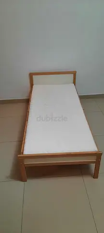 Single wooden bed with mattress in good condition for children