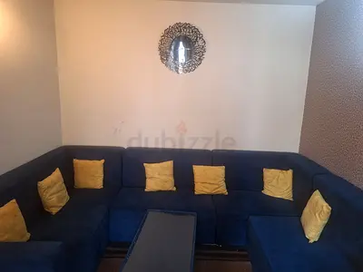 Large U-shaped Blue Fabric Sofa with Cushions