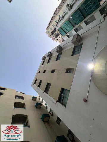 A clean, four-story building in Al Musalla