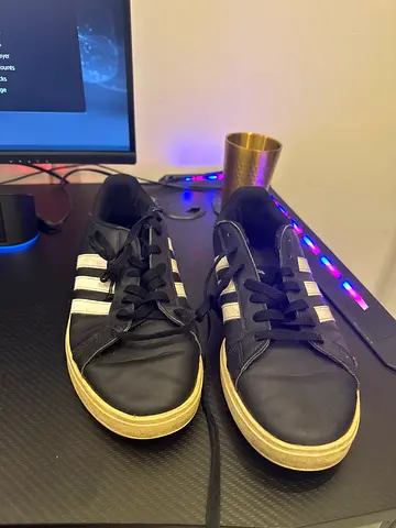 Black Adidas-style casual sneakers, used