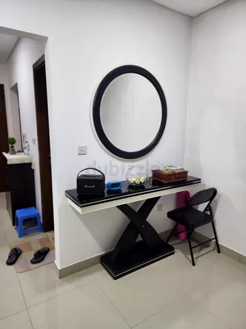 Black X-Base Console Table with Round Wall Mirror