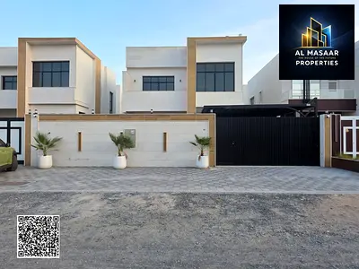 For Sale: Stone-fronted villa in Al Helio 2, Ajman, 3 master bedrooms, majlis, living room, American-style kitchen, land area 3164 sq ft, built-up are