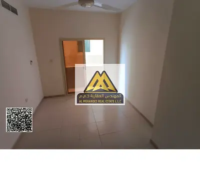 1BR apt Al Hamidiya 1 Ajman. Balcony, central AC, near Ajman University. AED 27,000 yearly, 4 payments, prime location, spacious.
