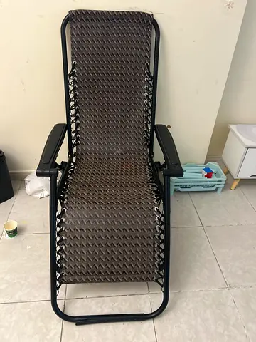Zero-gravity reclining lounge chair — brown woven seat, good condition