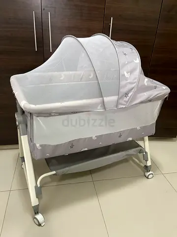 Brand new baby bassinet with canopy and wheels - grey